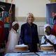 Queen Consort Camilla with two bakers of Victoria Sponge Cake